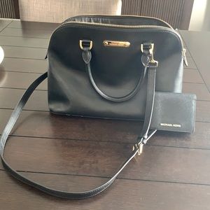 Authentic Michael Kors black crossbody and small wallet.